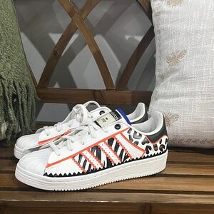 adidas White Sneakers with Orange & Black Graphic Accents